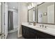 Beautiful bathroom featuring a double sink vanity with modern fixtures and a shower-tub combo at 19719 Cypress Bridge Dr, Odessa, FL 33556