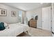 Inviting bedroom featuring natural light, dresser with decor, and cozy accents, for a relaxing space at 19719 Cypress Bridge Dr, Odessa, FL 33556