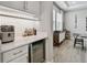 Well-lit butler's pantry featuring modern cabinets, quartz countertops, and ample storage space at 19719 Cypress Bridge Dr, Odessa, FL 33556