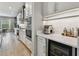 Modern butler's pantry with white cabinets, stainless steel appliances, and ample counter space at 19719 Cypress Bridge Dr, Odessa, FL 33556