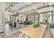Bright common area with a kitchen island, seating, and large windows for abundant natural light at 19719 Cypress Bridge Dr, Odessa, FL 33556