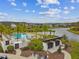 Aerial view of the community pool area, surrounded by palm trees and lounge chairs at 19719 Cypress Bridge Dr, Odessa, FL 33556