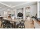 Dining room features wood floors and arched entryways that create an open, inviting space at 19719 Cypress Bridge Dr, Odessa, FL 33556