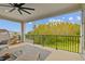 This spacious covered patio provides scenic views of the lush greenery and a tranquil escape at 19719 Cypress Bridge Dr, Odessa, FL 33556