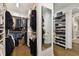 Walk-in closet with an abundance of shelving, storage racks, and a full length mirror at 19719 Cypress Bridge Dr, Odessa, FL 33556