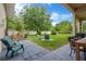 Large backyard with lush grass, a mature tree, and a white vinyl fence at 20749 Auburn Leaf Trl, Land O Lakes, FL 34638