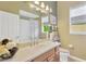 Bathroom features a single sink and walk-in shower at 20749 Auburn Leaf Trl, Land O Lakes, FL 34638