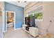 Bedroom features a television and connecting door at 20749 Auburn Leaf Trl, Land O Lakes, FL 34638