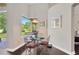 Bright breakfast nook with a charming table set and a view of the backyard at 20749 Auburn Leaf Trl, Land O Lakes, FL 34638