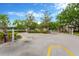 Gated community entrance with well-maintained landscaping and security features, offering privacy and exclusivity at 20749 Auburn Leaf Trl, Land O Lakes, FL 34638