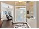 Inviting foyer with wood floors, high ceilings, and view of the office space at 20749 Auburn Leaf Trl, Land O Lakes, FL 34638