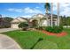 Charming single-Gathering home features a well-manicured lawn and mature landscaping at 20749 Auburn Leaf Trl, Land O Lakes, FL 34638