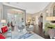 Open-concept living room featuring stylish decor, wood floors, and abundant natural light at 20749 Auburn Leaf Trl, Land O Lakes, FL 34638
