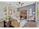 Cozy living room with modern decor, featuring a comfortable sofa, artwork, and sliding glass doors at 20749 Auburn Leaf Trl, Land O Lakes, FL 34638