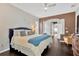 Serene main bedroom with an arched doorway and large windows, filled with natural light at 20749 Auburn Leaf Trl, Land O Lakes, FL 34638