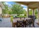 Covered patio with seating area and a view of the expansive backyard at 20749 Auburn Leaf Trl, Land O Lakes, FL 34638