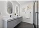Sleek bathroom featuring dual sinks, modern fixtures, and a glass-enclosed shower at 2112 4Th S St, St Petersburg, FL 33705