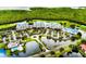Gorgeous aerial view of condo buildings, scenic waterways, and lush green surroundings, highlighting the community's serene setting at 2333 Feather Sound Dr # B511, Clearwater, FL 33762