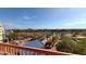 A scenic aerial view of a community showcasing lush landscaping, a serene lake, and various buildings at 2333 Feather Sound Dr # B511, Clearwater, FL 33762