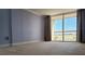 Bright bedroom with balcony access, offering ample natural light and a seamless connection to outdoor living at 2333 Feather Sound Dr # B511, Clearwater, FL 33762