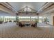 Spacious lobby area with comfortable seating, elegant lighting, and views of the surrounding landscape at 2333 Feather Sound Dr # B511, Clearwater, FL 33762