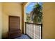 Relax on this cozy balcony with wooden seating and a great view of the neighborhood street at 2410 W Azeele St # 228, Tampa, FL 33609