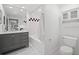 Modern bathroom featuring a vanity with drawers, tub and shower, and a white tile floor at 2410 W Azeele St # 228, Tampa, FL 33609
