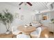 Inviting dining area featuring modern chairs, a round table, and a view into the living area at 2410 W Azeele St # 228, Tampa, FL 33609