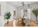 Cozy dining area with round wood table, four chairs, and a bright window view at 2410 W Azeele St # 228, Tampa, FL 33609