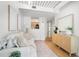 Stylish living room featuring a comfortable sofa, wood floors, and contemporary furnishings at 2410 W Azeele St # 228, Tampa, FL 33609
