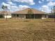 Spacious backyard with ample room for outdoor activities and potential landscaping, offering a serene retreat at 26357 Trinilas Dr, Punta Gorda, FL 33983