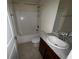 Bathroom featuring a shower-tub combo and single sink vanity at 26357 Trinilas Dr, Punta Gorda, FL 33983