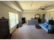 Bright bedroom featuring carpet flooring and a tray ceiling at 26357 Trinilas Dr, Punta Gorda, FL 33983