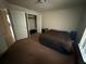 Cozy bedroom featuring carpet flooring and a closet at 26357 Trinilas Dr, Punta Gorda, FL 33983