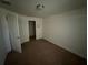 Compact bedroom featuring carpet flooring and a closet at 26357 Trinilas Dr, Punta Gorda, FL 33983