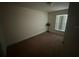 Cozy bedroom featuring carpet flooring and natural light at 26357 Trinilas Dr, Punta Gorda, FL 33983