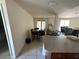 Open dining area with tile floors and views into the living room and kitchen at 26357 Trinilas Dr, Punta Gorda, FL 33983