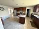 Bright kitchen featuring an island, stainless appliances, and ample cabinet space at 26357 Trinilas Dr, Punta Gorda, FL 33983