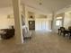 Spacious living room with tile flooring and open layout, ready for personalization at 26357 Trinilas Dr, Punta Gorda, FL 33983
