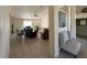 Open living room with tile floors, ceiling fan, and views to additional living space at 26357 Trinilas Dr, Punta Gorda, FL 33983