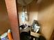 Interior view under a sink revealing plumbing and storage items at 26357 Trinilas Dr, Punta Gorda, FL 33983