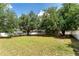 Expansive backyard with mature trees and lawn at 2803 Bent Leaf Dr, Valrico, FL 33594