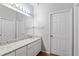 Clean bathroom with granite countertops, large mirror, and updated lighting at 2803 Bent Leaf Dr, Valrico, FL 33594