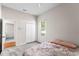 Neutral bedroom featuring a ceiling fan, carpet floors, and window at 2803 Bent Leaf Dr, Valrico, FL 33594