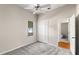 Neutral bedroom featuring a ceiling fan, carpet floors and a window at 2803 Bent Leaf Dr, Valrico, FL 33594