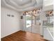 Dining area with a sliding door to patio, modern lights and granite countertops in the kitchen at 2803 Bent Leaf Dr, Valrico, FL 33594