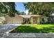 Charming single-story home with a well-manicured lawn, mature trees, and a three-car garage at 2803 Bent Leaf Dr, Valrico, FL 33594