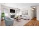 Cozy living room featuring a fireplace, neutral decor, and ample natural light at 2803 Bent Leaf Dr, Valrico, FL 33594
