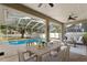 Covered patio with outdoor dining area, lounge and view of the pool at 2803 Bent Leaf Dr, Valrico, FL 33594
