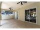 Covered patio features sliding doors, ceiling fans and a view of the outdoors at 2803 Bent Leaf Dr, Valrico, FL 33594